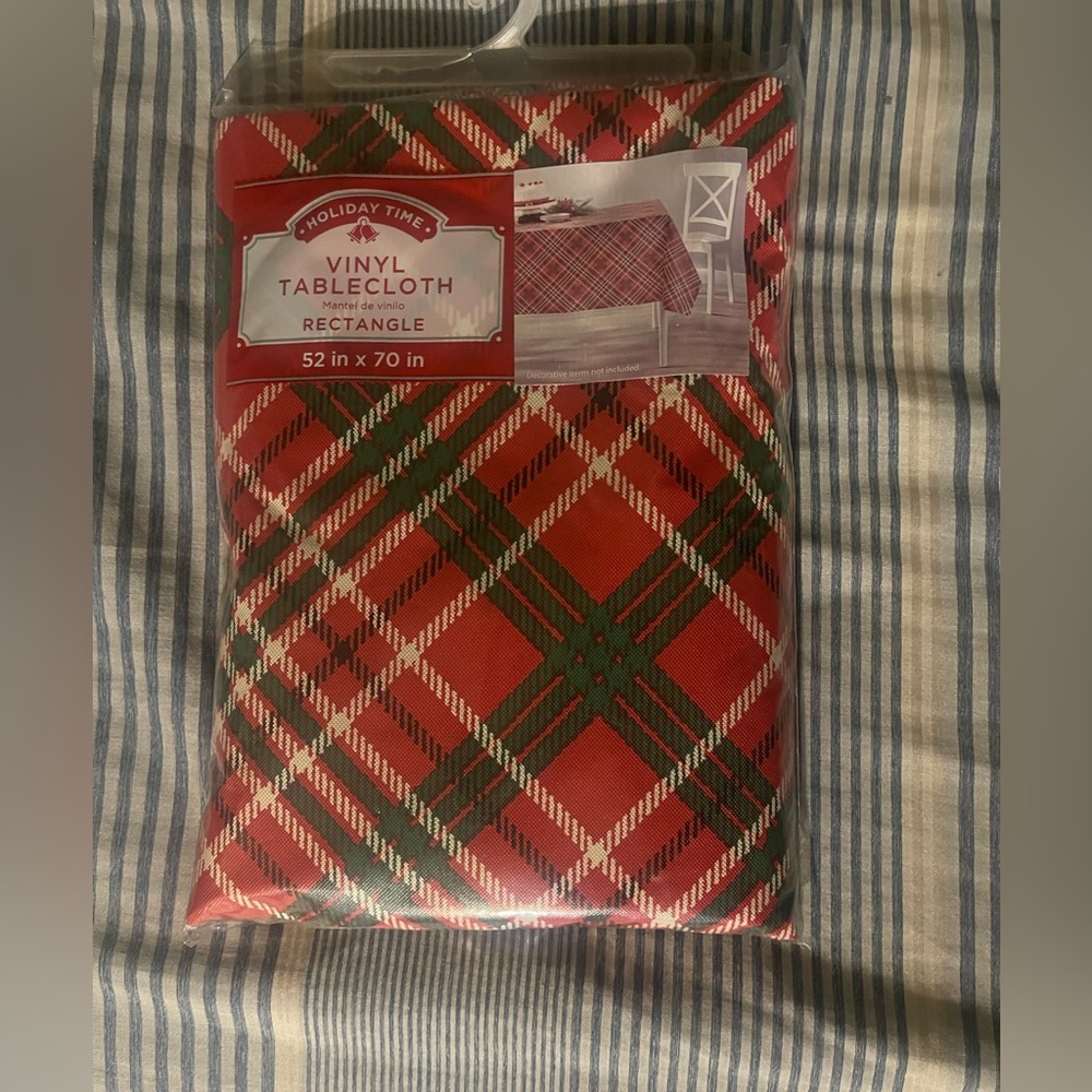Tablecloth by Holiday Time it’s vinyl  52x70 inch rectangle for any occasion